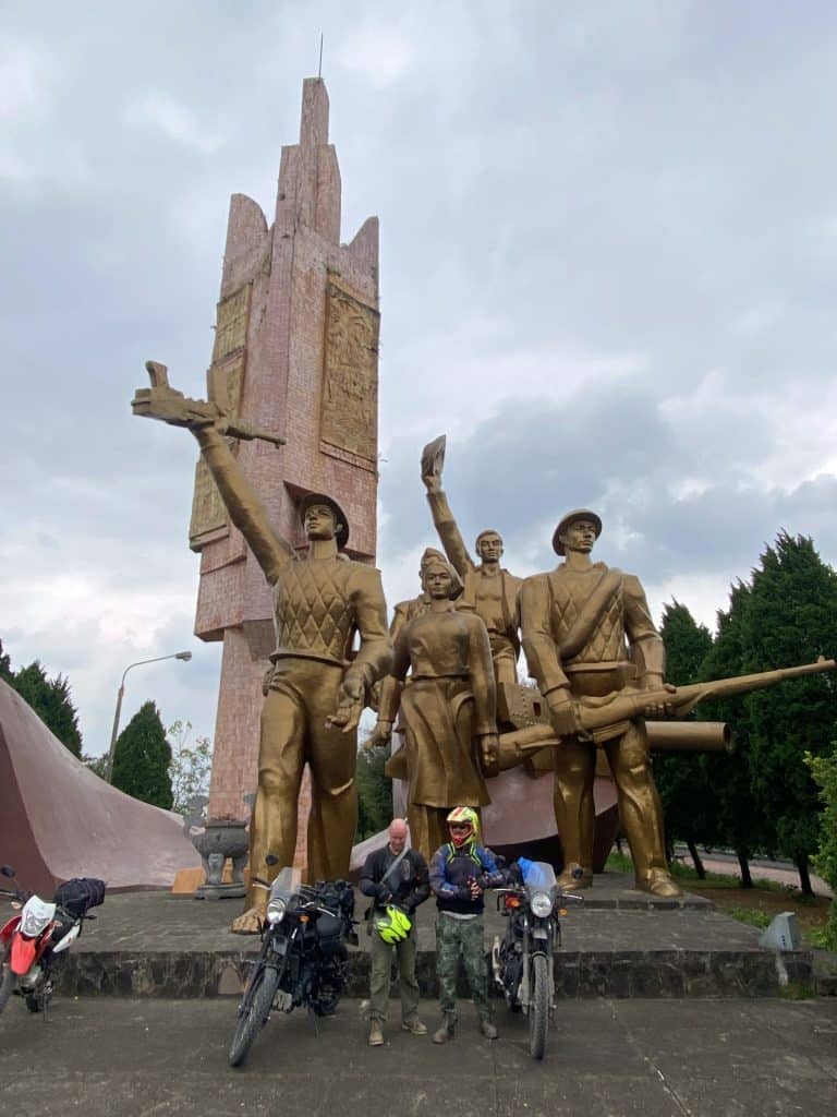 Riders in front of the Victory Monument in Doan Hung, Phu Tho, Vietnam