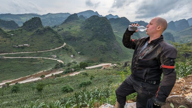 Danny stops for a drink at the M curve in Ha Giang
