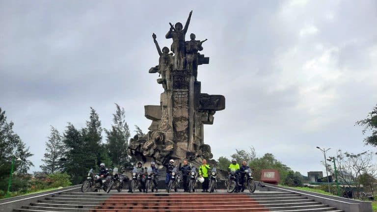 A group of our riders at a victory monument in Vietnam