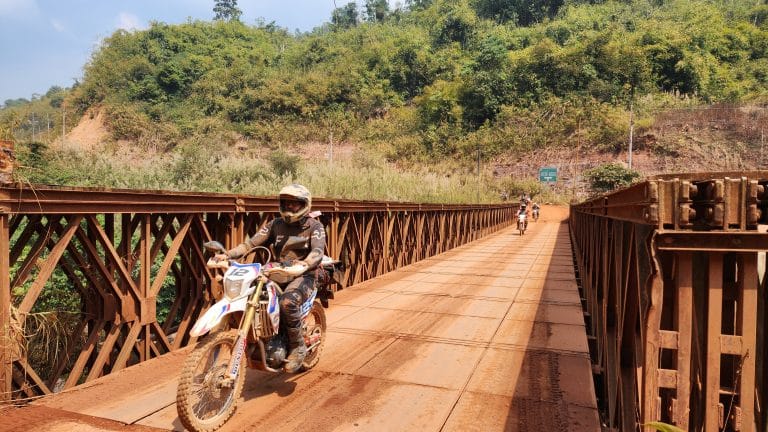 ADV Outriders cross bridge in Cambodia