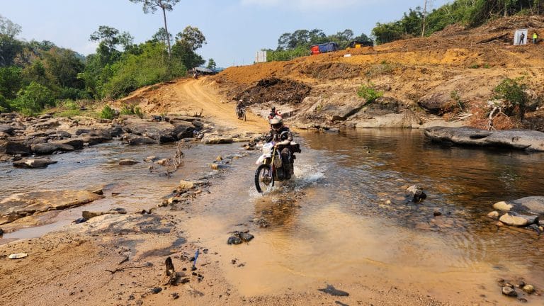 four ADV Outriders cross river in Cambodia